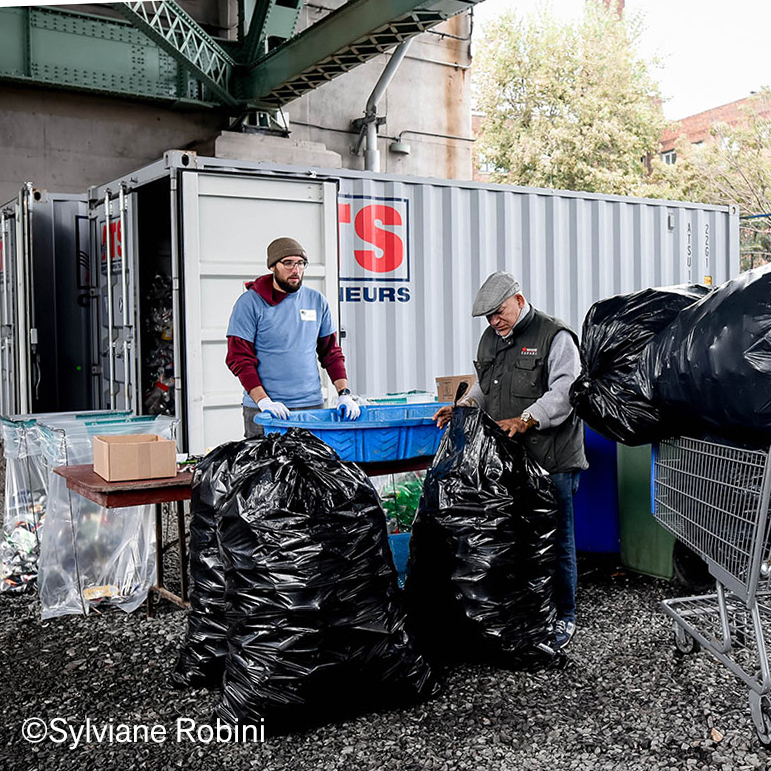 Binners bagging bottles and cans